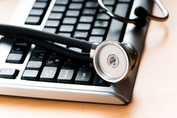 Stethoscope and keyboard illustrating concept of digital securit