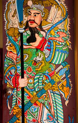 Obraz na płótnie Canvas chinese door of shrine with a lion head