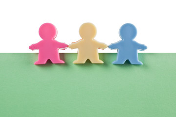 3 male figurines on blank paper