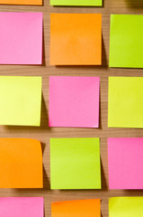 Fototapeta premium Many reminder notes on the wooden background