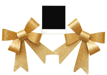 old photo between golden bows