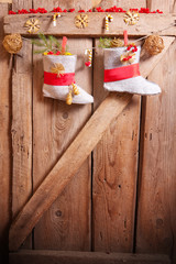 Christmas stocking hanging on wooden background