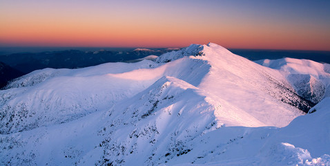 Sunset in mountains. Winter landscape