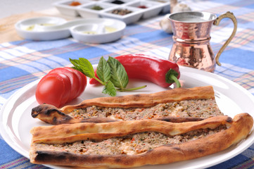 Traditional Turkish pide with meat.