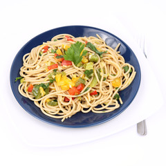Spaghetti with vegetables on a plate on white background