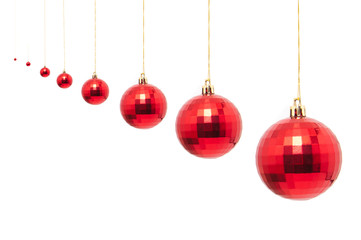 red christmas bauble with ribbon isolated on white background