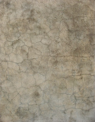 worn gray beige blue grunge wall with multiple cracks