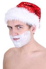 young man with shaving foam in santa hat