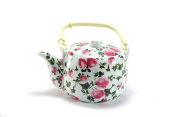 Teapot with floral ornament on white background