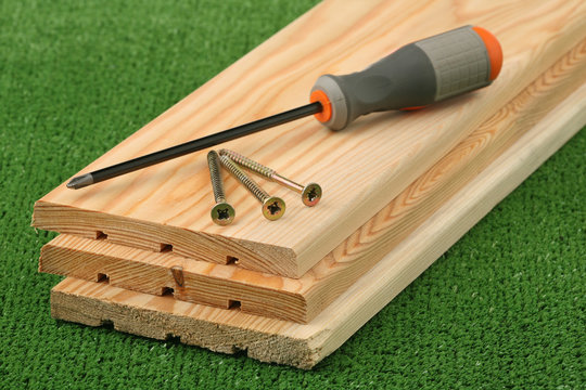 Three boards, screws and screw-driver
