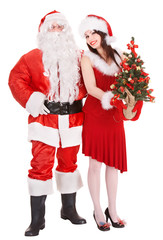 Santa claus and girl holding christmas tree.