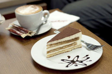 A cup of coffee and dessert