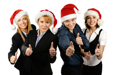 Four young and smart business persons in Christmas hats