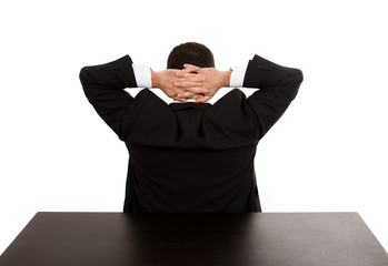 Back of young businessman relaxing on the desk office