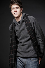 Fototapeta premium Happy man wearing gray sweater with hood.