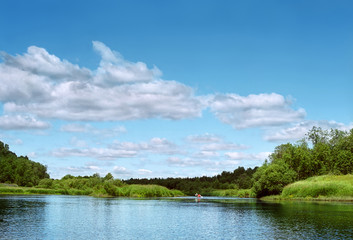 Obraz na płótnie Canvas Swimming on a canoe on the river
