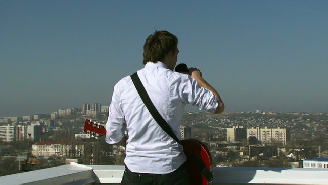 Musician drink coffee on the roof