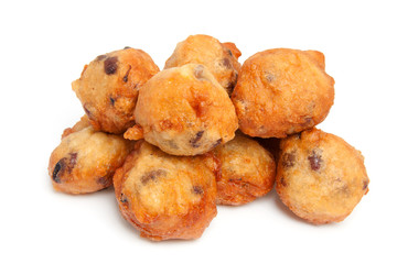 pile Dutch donut also known as oliebollen over white background