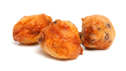 Thee Dutch donut also known as oliebollen over white background