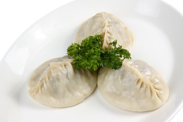 Oriental meat dumplings with parsley