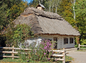 Ancient traditional ukrainian rural cottage with a straw roof