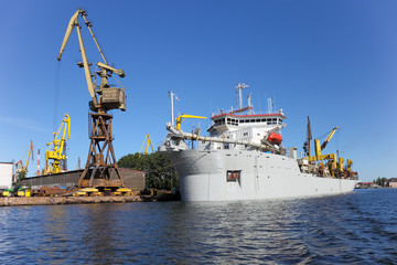 Dredging ship berthed at the wharf port in Gdansk, Poland.