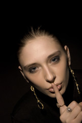 Woman making silence gesture