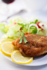 Schnitzel  with lemon and salad