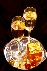 Christmas gift box with glasses of champagne