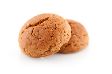 Two  pepernoten (ginger nuts) in closeup over white background