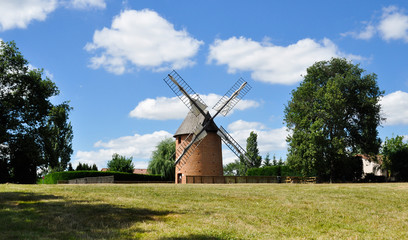 Fototapeta na wymiar Old renovated windmill