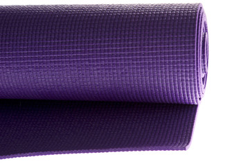 rolled yoga mat on white