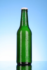 Bottle of beer on blue background