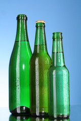 Bottles of beer on blue background