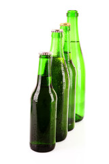 Many bottles of beer isolated on white