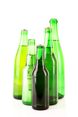 Many bottles of beer isolated on white