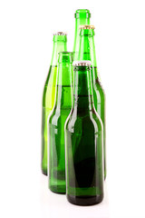 Many bottles of beer isolated on white