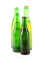 Many bottles of beer isolated on white