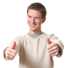 young smiling man with thumbs up isolated over white background