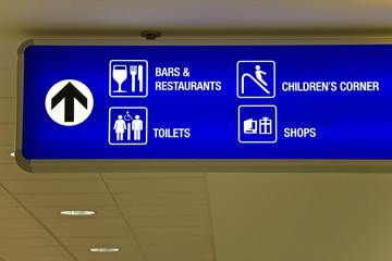 Blue airport direction sign