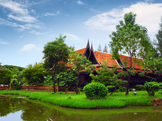 Temple on the green riverside in the park