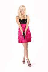 Sexy woman with handgun in studio