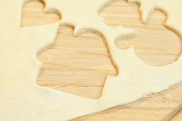 cut in the dough snowman, heart, and  house