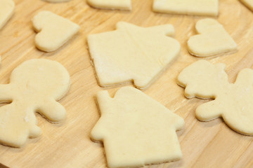 cut in the dough snowman, heart, and  house