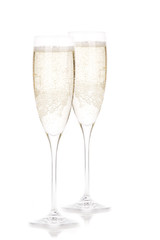 A glass of champagne, isolated on a white background.
