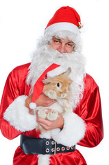 Photo of happy Santa Claus holding a cute rabbit in a santa hat