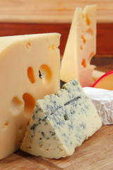 delicious cheeses on wood