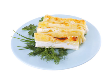 cheese cannelloni on blue plate