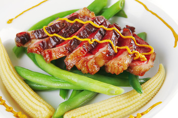 meat served on white with mustard