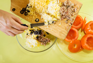 making stuff for  farci tomato salad. Cooking  in series